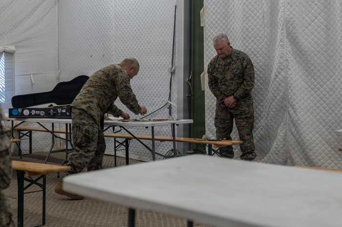 Navy chaplains conduct communion for Marines and sailors during a Baltic religious service in June 2026