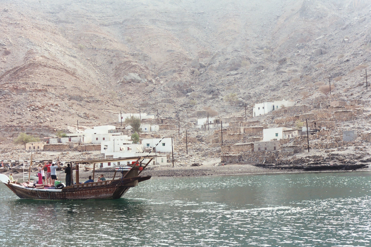 A traditional dhow passing Bukha village on the Musandam coast of Oman, near the waters where a tanker was struck off Oman