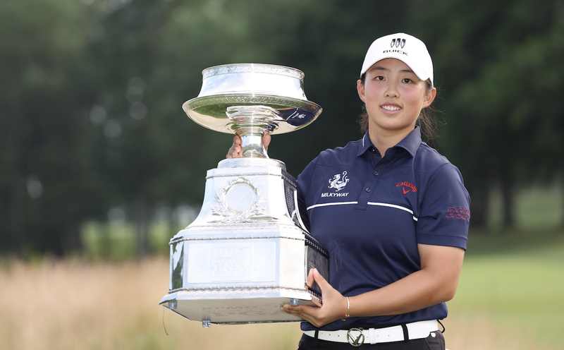 China's Yin Ruoning holding the Women's PGA Championship trophy