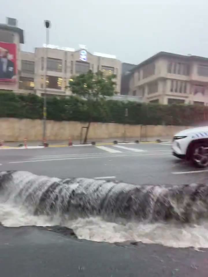 Floodwater pouring over a road surface in Istanbul during the October 2026 floods