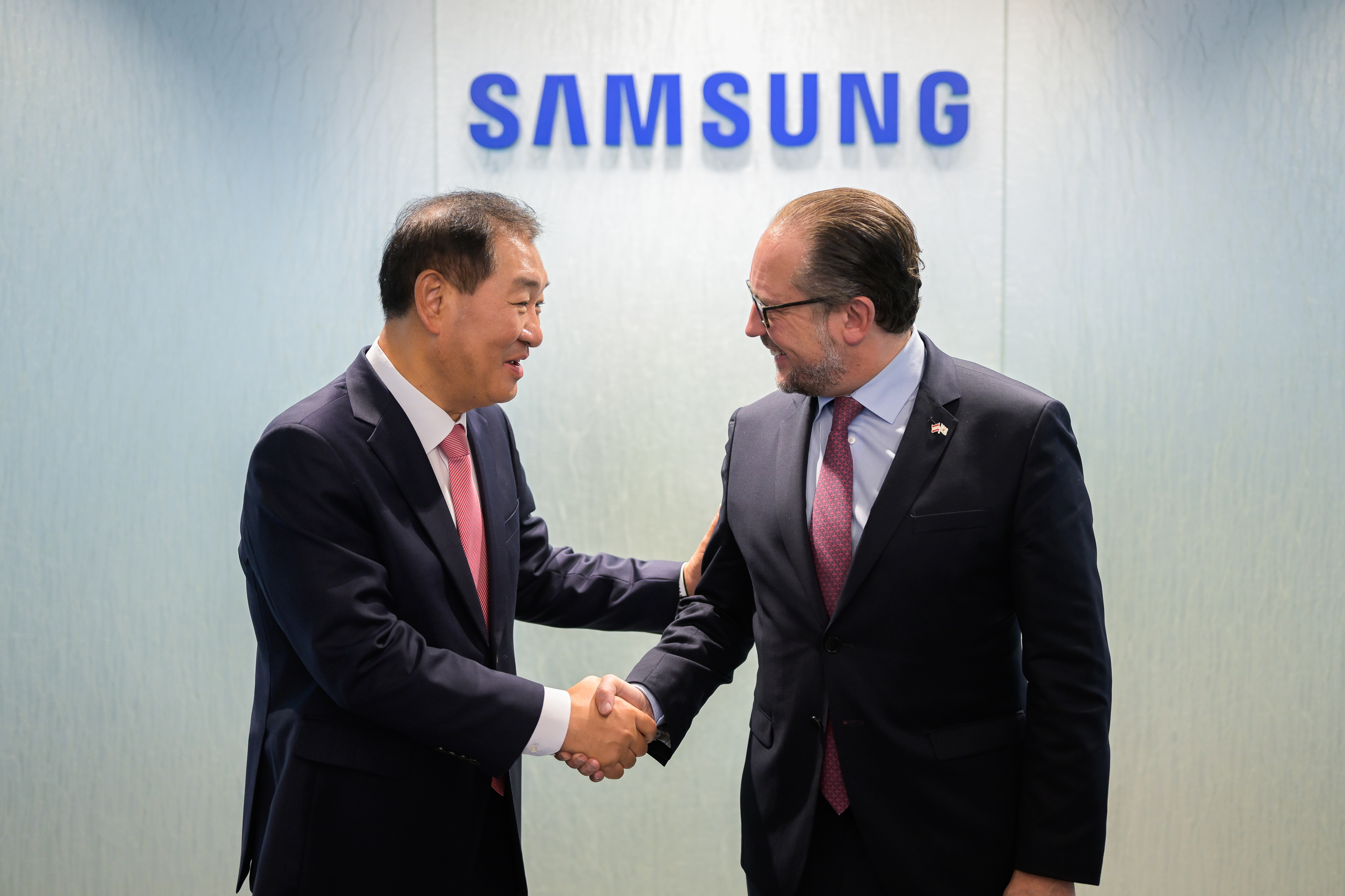 Samsung substrate expansion Sejong Nvidia Tesla — a handshake under the Samsung logo at Samsung headquarters, file photo