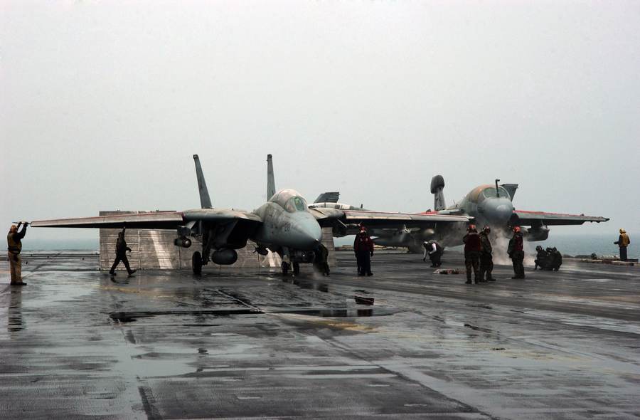 An F-14D Tomcat and EA-6B Prowler prepare to launch from USS Theodore Roosevelt