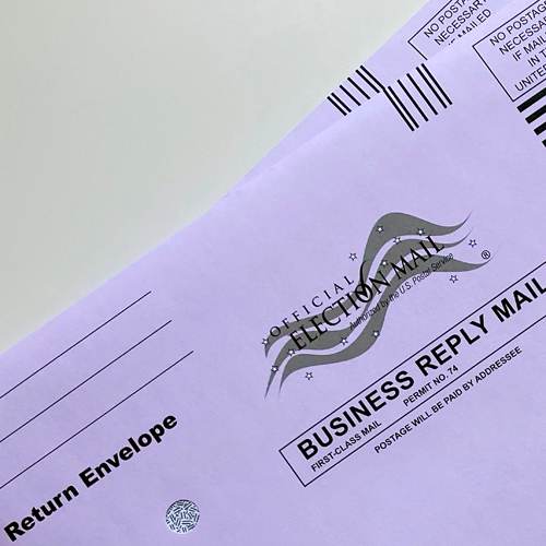 Mail-in ballot envelopes illustrating the Trump mail voting reversal before the 2026 midterms