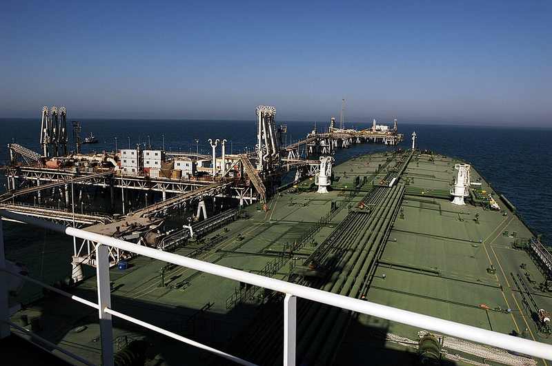 Oil tanker loading crude in the Persian Gulf near the Strait of Hormuz reopening debate