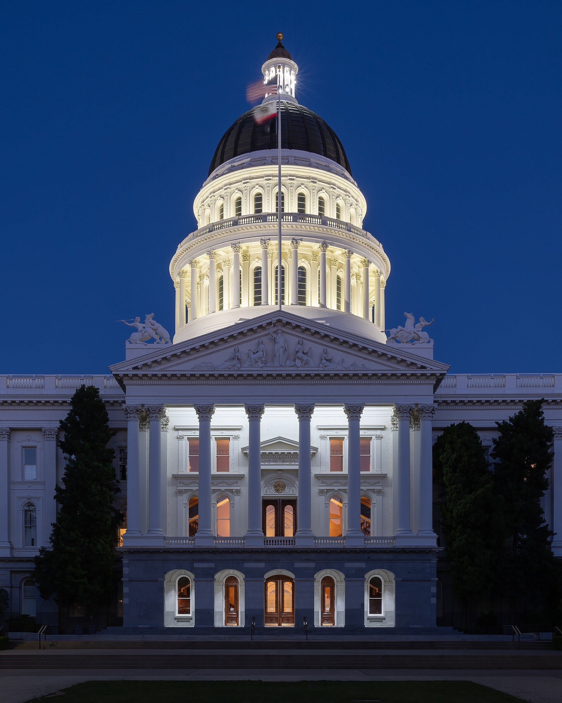 The California State Capitol in Sacramento at dusk, seat of the state government refusing the DOJ demand to set aside 20,000 flagged voters' ballots