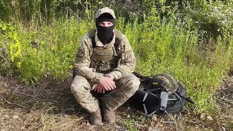 Ukrainian drone operator with a quadcopter; drones now dominate the skies over Oleshky's roads