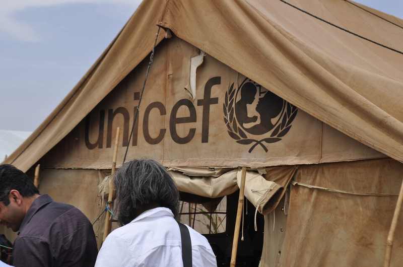 UNICEF humanitarian tent at Abu Shouk displacement camp during Sudan's humanitarian crisis