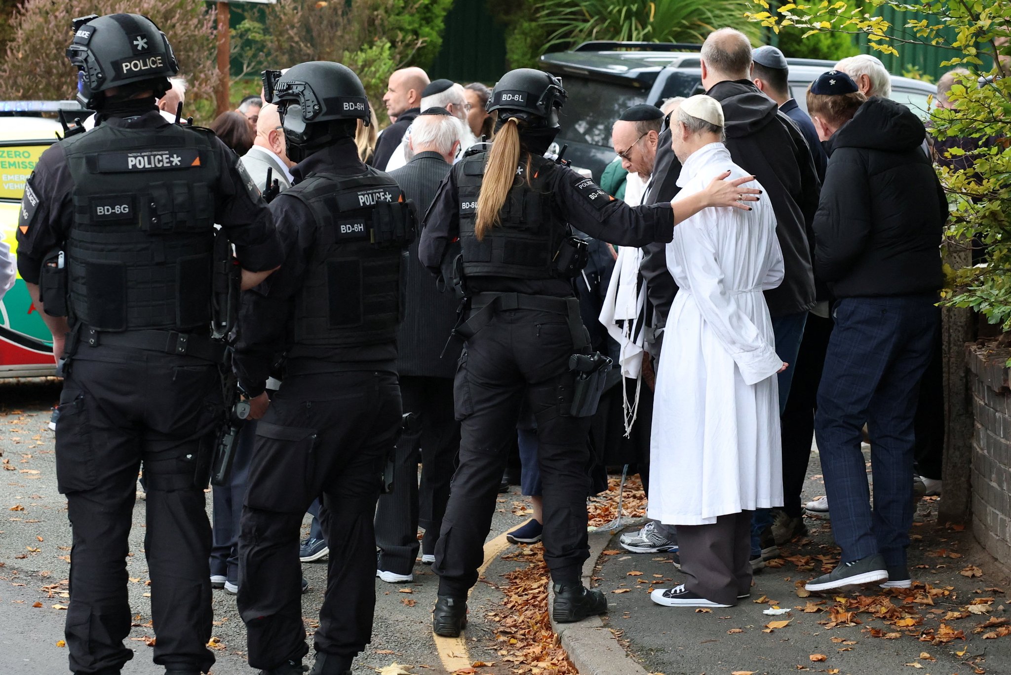 Armed police protecting Jewish worshippers after the 2025 attack at Heaton Park Hebrew Congregation Synagogue