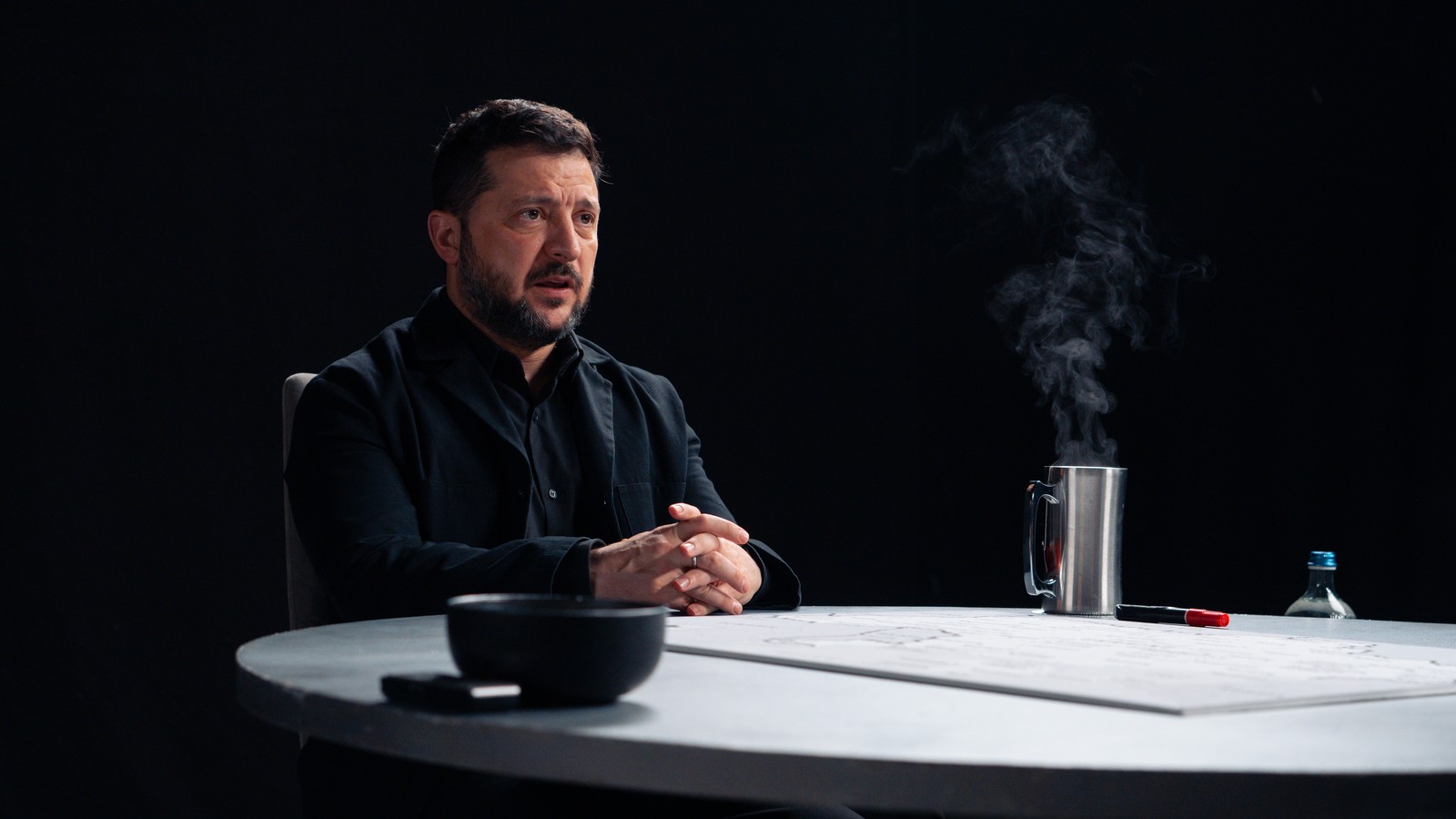 President Volodymyr Zelenskyy seated at the table during his Zelenskyy Diary of a CEO interview with Steven Bartlett