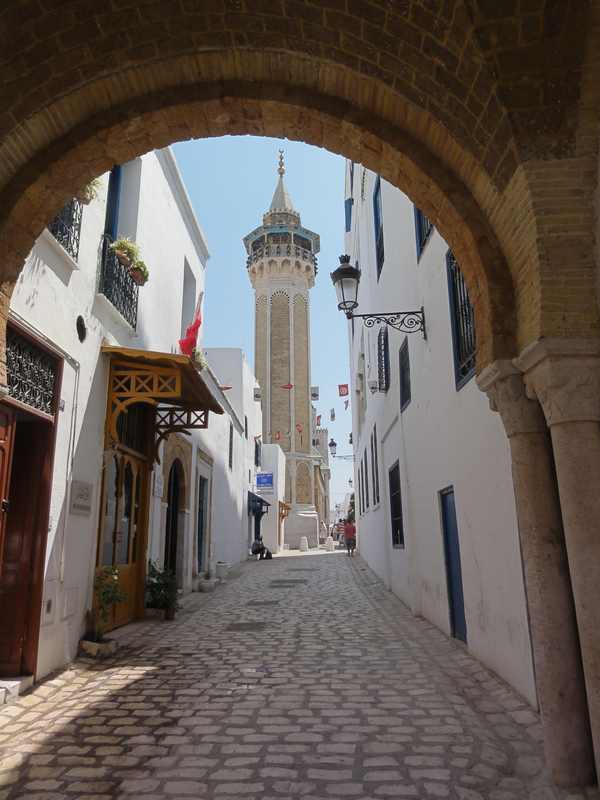 Historic Sidi Ben Arous street and minaret in Tunis, Tunisia, during the 2026 travel advisory period