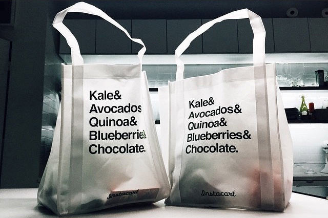 Instacart grocery delivery bags on a kitchen countertop