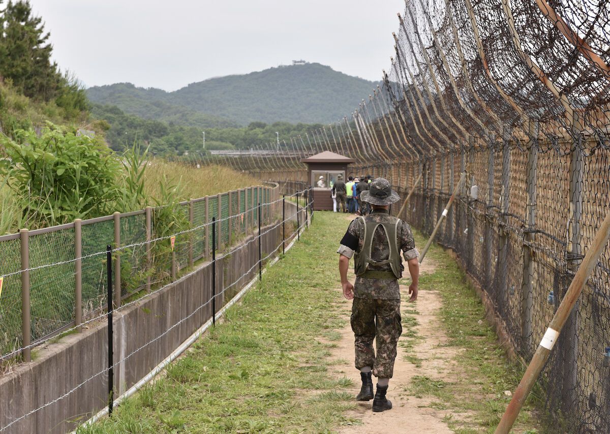 South Korean soldier patrolling a fortified DMZ corridor amid the North Korea DMZ mines apology dispute