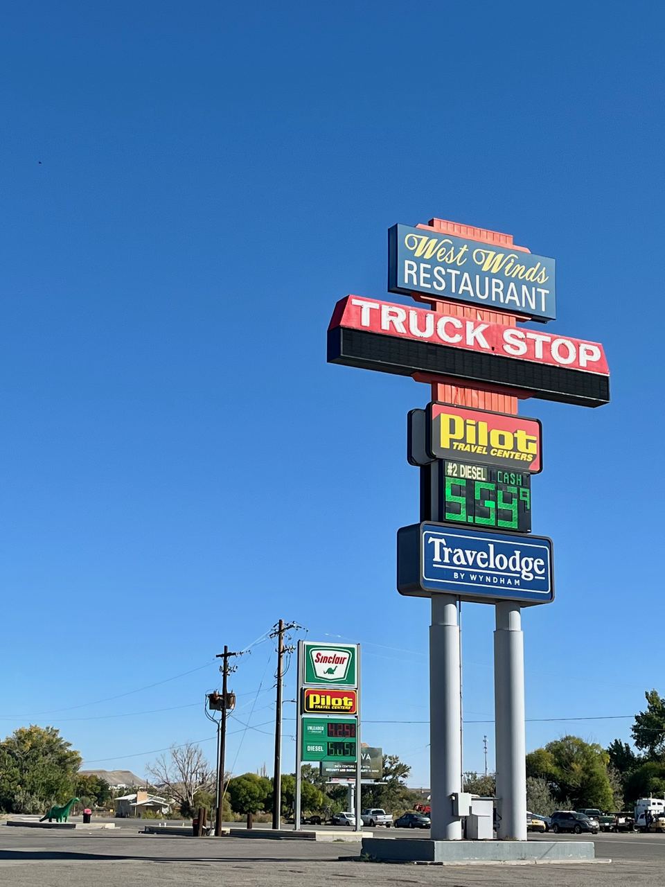 A Sinclair gas station and truck stop sign in Green River, Utah — fuel prices are among the pressures consumers cited in the September 2026 Michigan sentiment survey