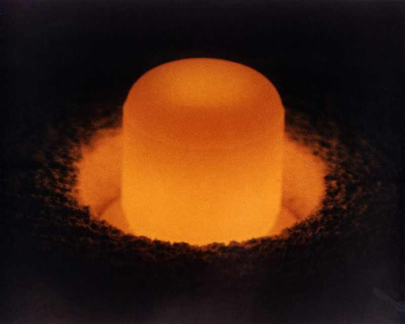 A plutonium-238 pellet glowing red-hot — the radioactive material Jacob Miller admitted importing from Russia and selling by mail