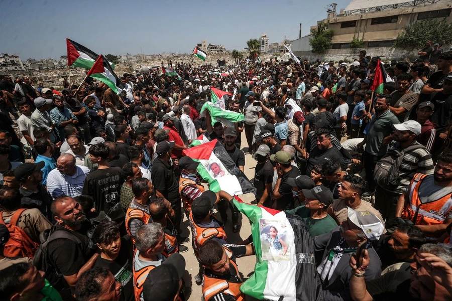 Gaza 105 bodies buried October 2026 mass funeral procession