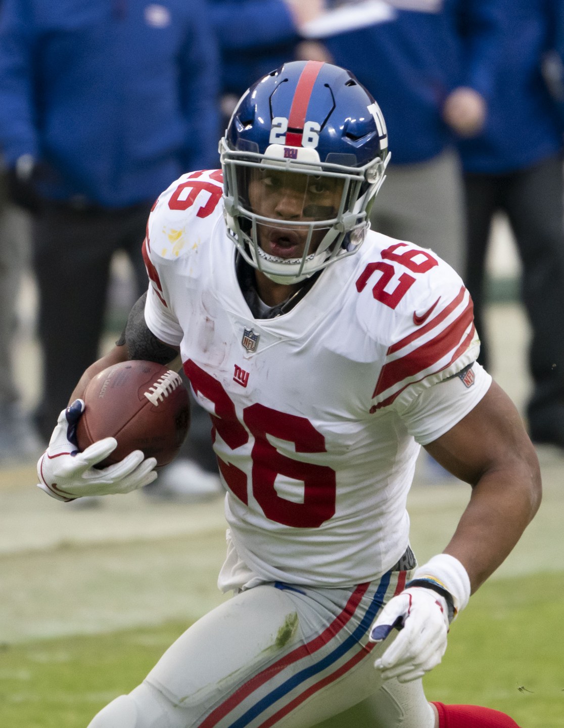 Saquon Barkley carrying the ball in a file photo, who scored early but did not finish the Cowboys Eagles game with a back injury