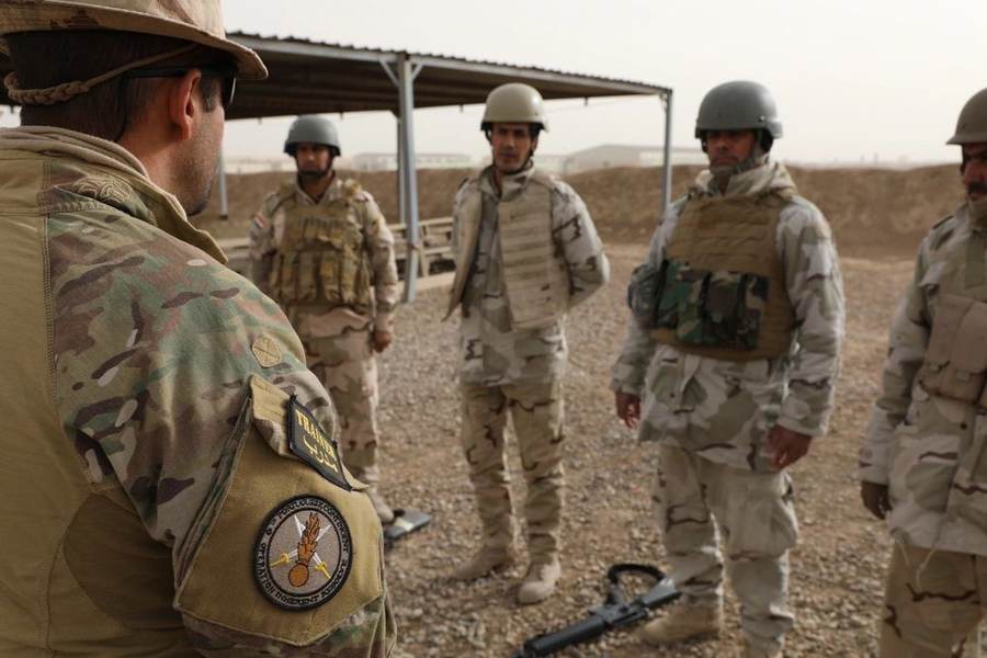 Coalition instructor trains Iraqi soldiers during Operation Inherent Resolve before US troops leave Iraq