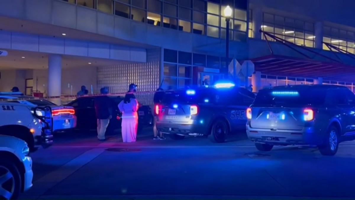 Sheriff's vehicles and investigators outside a Macon hospital after 12 teenagers were wounded in the Carolyn Crayton Park shooting