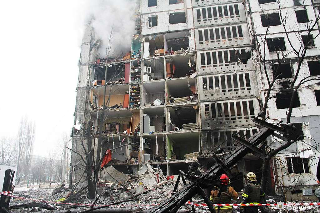 Rescue crews below a heavily damaged Kharkiv apartment block after a January 2024 Russian attack — file image illustrating the September 2026 Kharkiv guided bomb attack