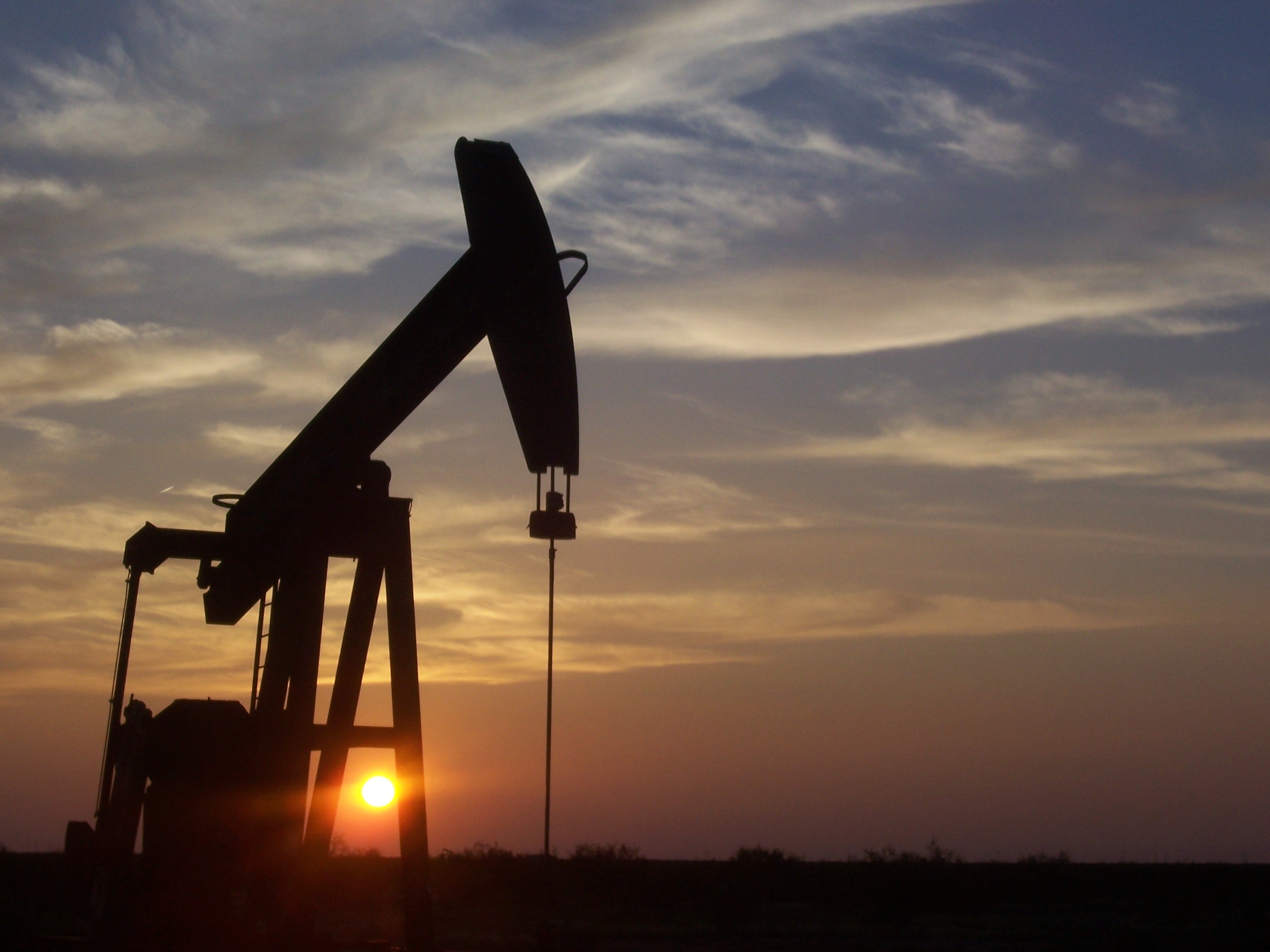 A pumpjack silhouetted against the sunset south of Midland, Texas, in a file photograph — US crude prices have risen about 46 percent for Brent since the Iran war began, and gasoline costs are a central issue in the November 3 midterm elections