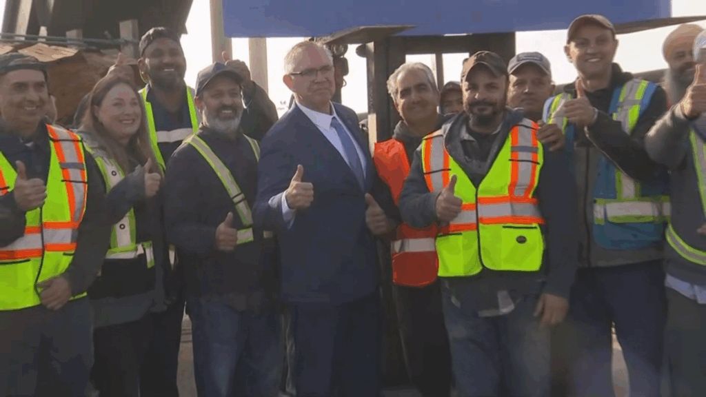 Lorne Doerkson on the campaign trail with workers in high-visibility vests during the British Columbia election 2026 campaign