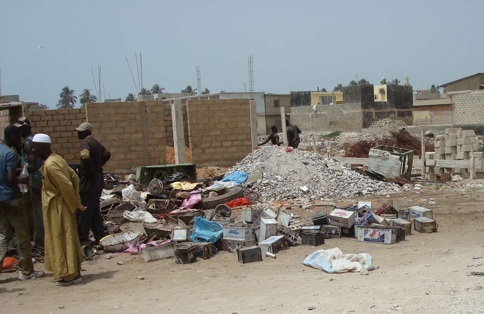 Used lead-acid batteries collected at an informal recycling site in Thiaroye, Dakar, Senegal — informal battery recycling is a major source behind the WHO lead poisoning warning