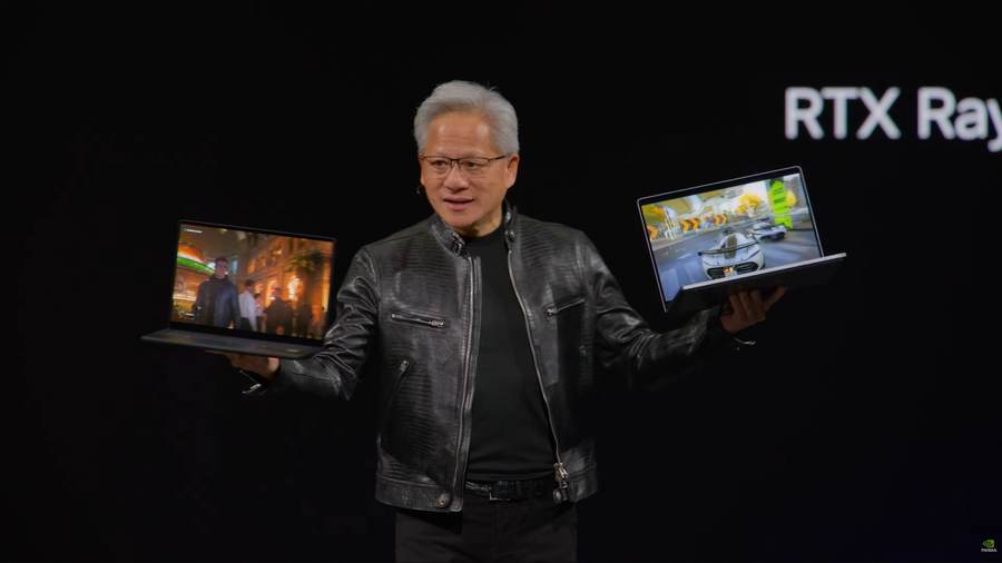 Nvidia CEO Jensen Huang displays RTX laptops during the Nvidia RTX Spark AI PC launch era