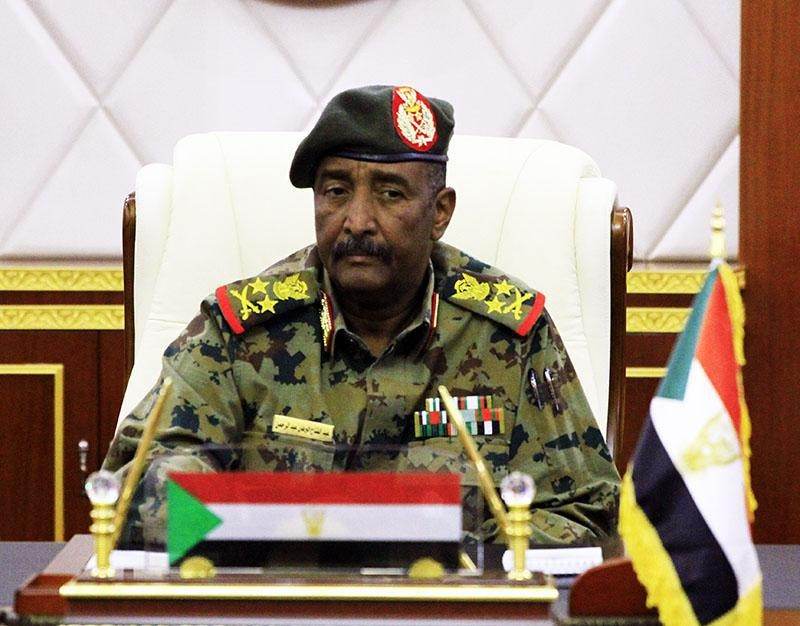 Sudanese Armed Forces leader Abdel Fattah al-Burhan speaking at a lectern