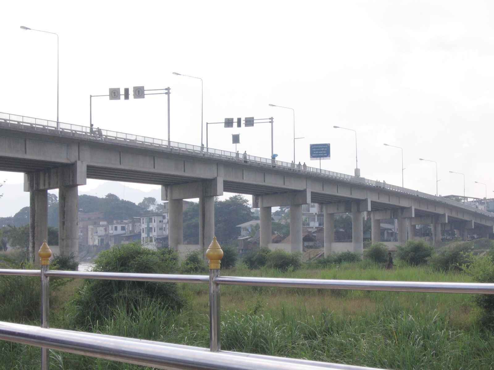 The Thai-Myanmar Friendship Bridge over the Moei River at Mae Sot, Thailand, the border crossing opposite Myawaddy near where a stray shell from fighting in Myanmar hit a Thai home