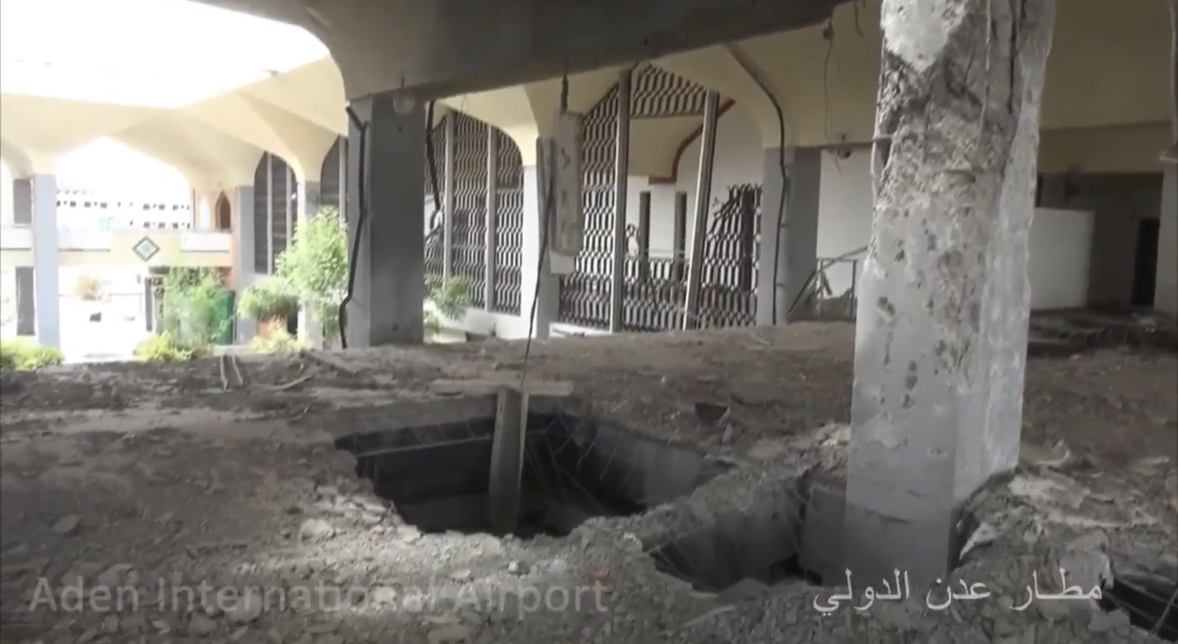 Inside the damaged terminal of Aden International Airport in a July 2017 file photo, with a crater torn through the floor — the airport named in the Houthi warning civilian airport Yemen reports