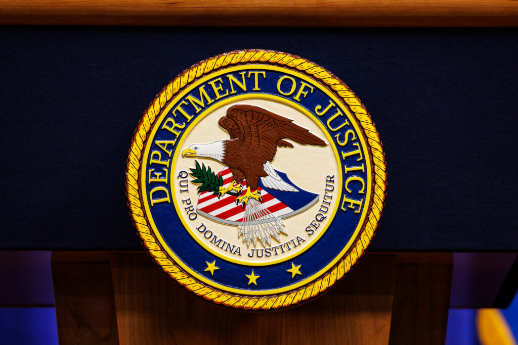 The seal of the US Department of Justice in Washington DC, the department behind the DOJ California noncitizen ballots letters