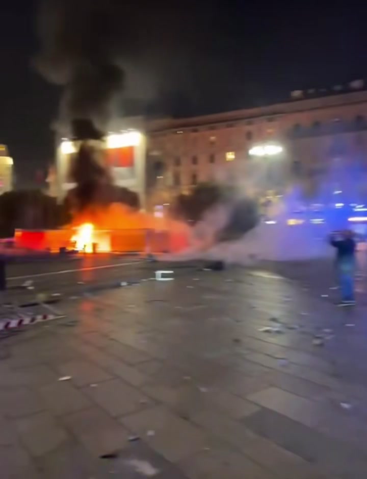 Italy protests — fires burning in Milan's Piazza del Duomo during the October 17 clashes