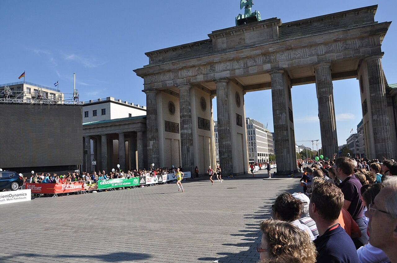 Runners pass the Brandenburg Gate during the Berlin Marathon, the world's fastest major marathon course