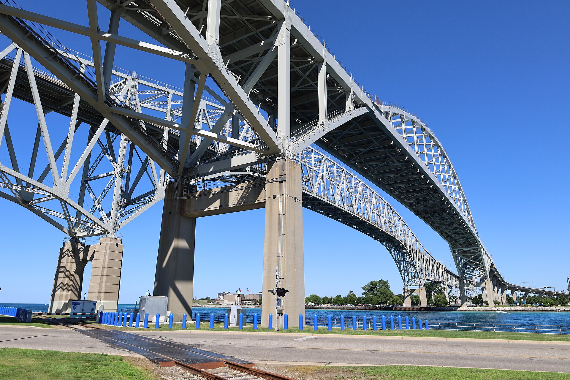 Trump Port Huron rally border backdrop — the Blue Water Bridge linking Port Huron, Michigan with Sarnia, Ontario