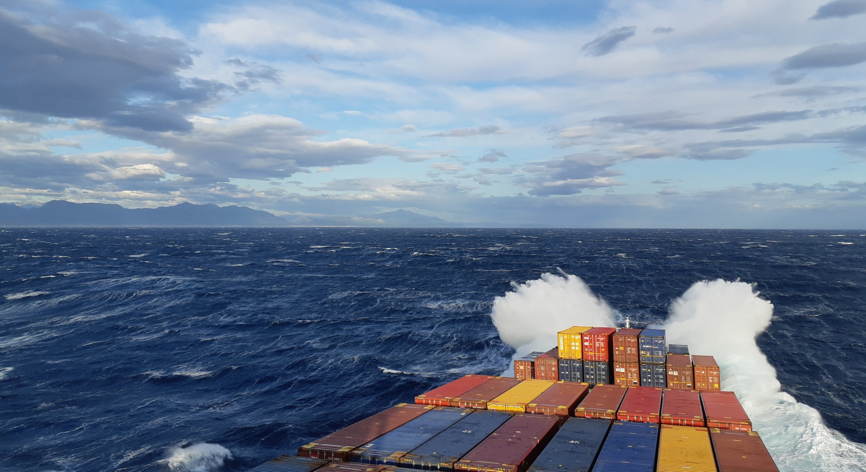 A container ship rides heavy seas, seen from its own deck — file photograph for the Black Sea ship drone attack on the Contship Jet off Bulgaria