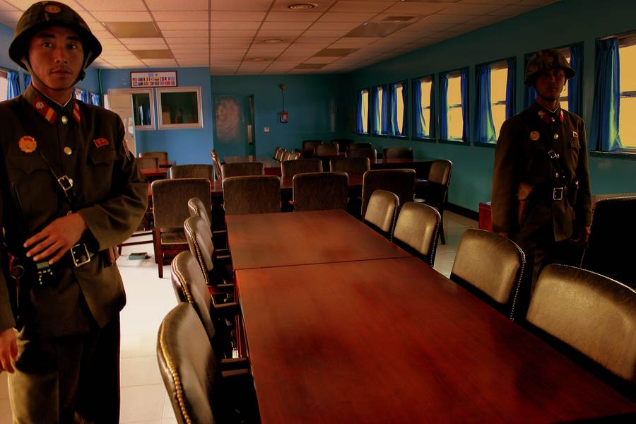 North Korean soldiers guarding a negotiation building at Panmunjom in the Demilitarized Zone