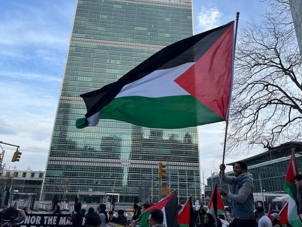 Pro-Palestinian demonstrators carrying Palestinian flags outside United Nations headquarters in New York