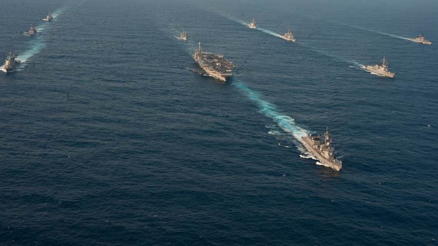USS George Washington sails with allied warships during a trilateral exercise