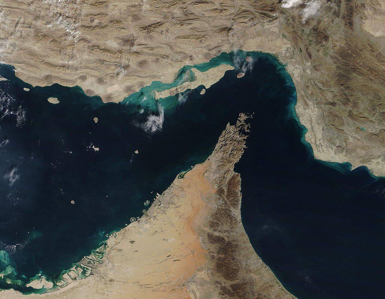 Satellite view of the Strait of Hormuz, the narrow chokepoint carrying about 30 percent of the world's seaborne oil, at the center of the September 2026 US-Iran standoff