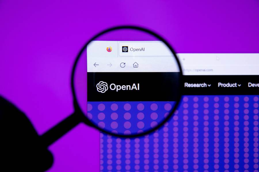 OpenAI logo under a magnifying glass as the OpenAI safety resignation brings company oversight into focus