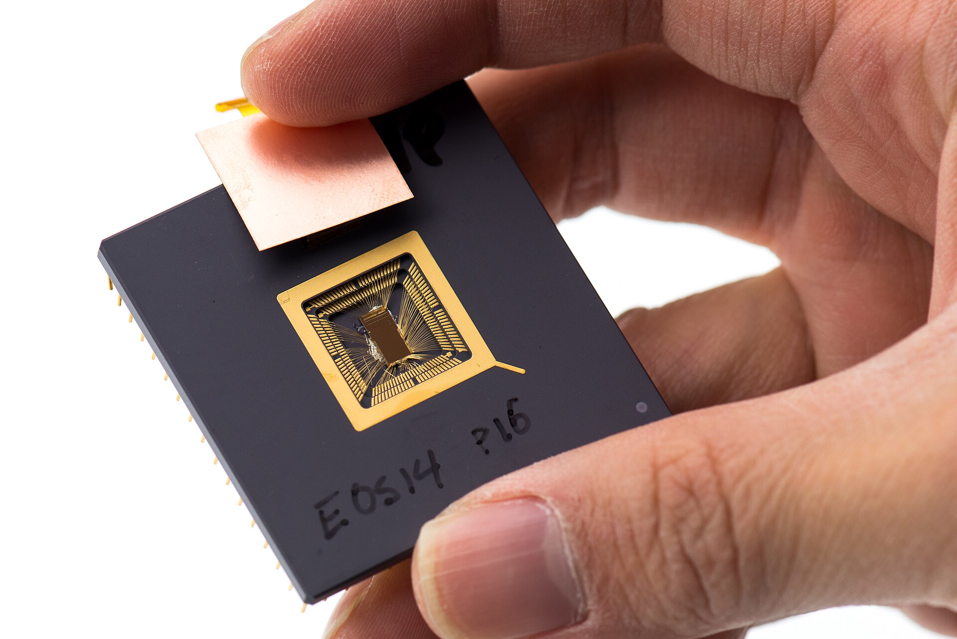 Yunsup Lee holding an early RISC-V prototype chip at UC Berkeley in 2013 — the open architecture behind the Tenstorrent $6.2 billion valuation funding round