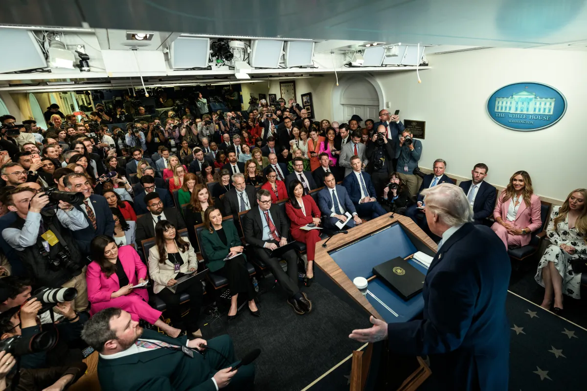 President Donald Trump addresses reporters in the White House press briefing room during the press access dispute