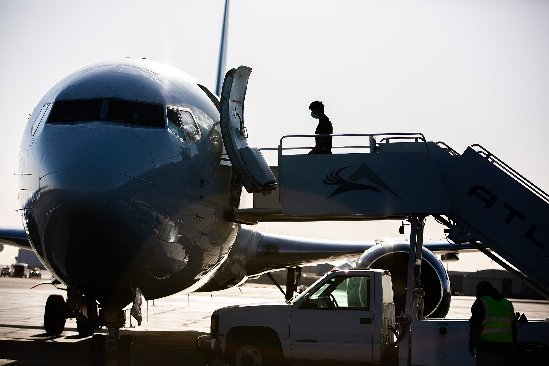 A man boards an ICE repatriation charter flight from Texas in May 2023 — US deportees Sierra Leone third-country removals
