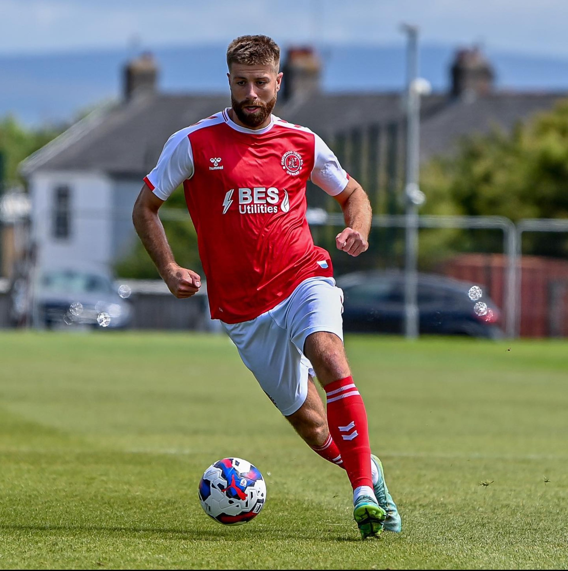 Shaun Rooney in action in Fleetwood Town's red and white kit — the colours the Cod Army adopted from the town's trawler fleet