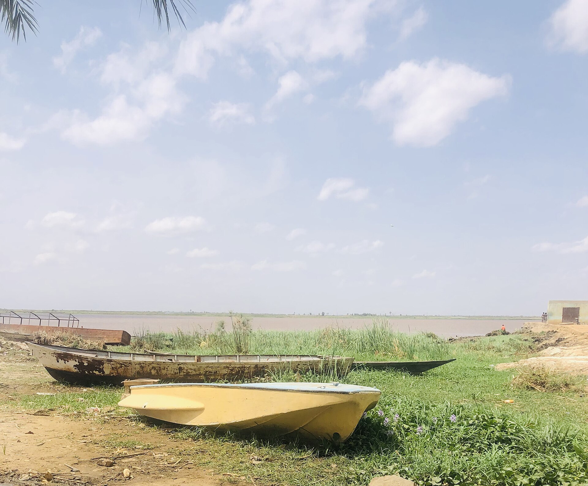 Boats on the bank of the White Nile at Kosti in White Nile State, Sudan — the state where a Sudan drone strike on the Um Dabaker power station at Rabak cut electricity on October 29, 2026