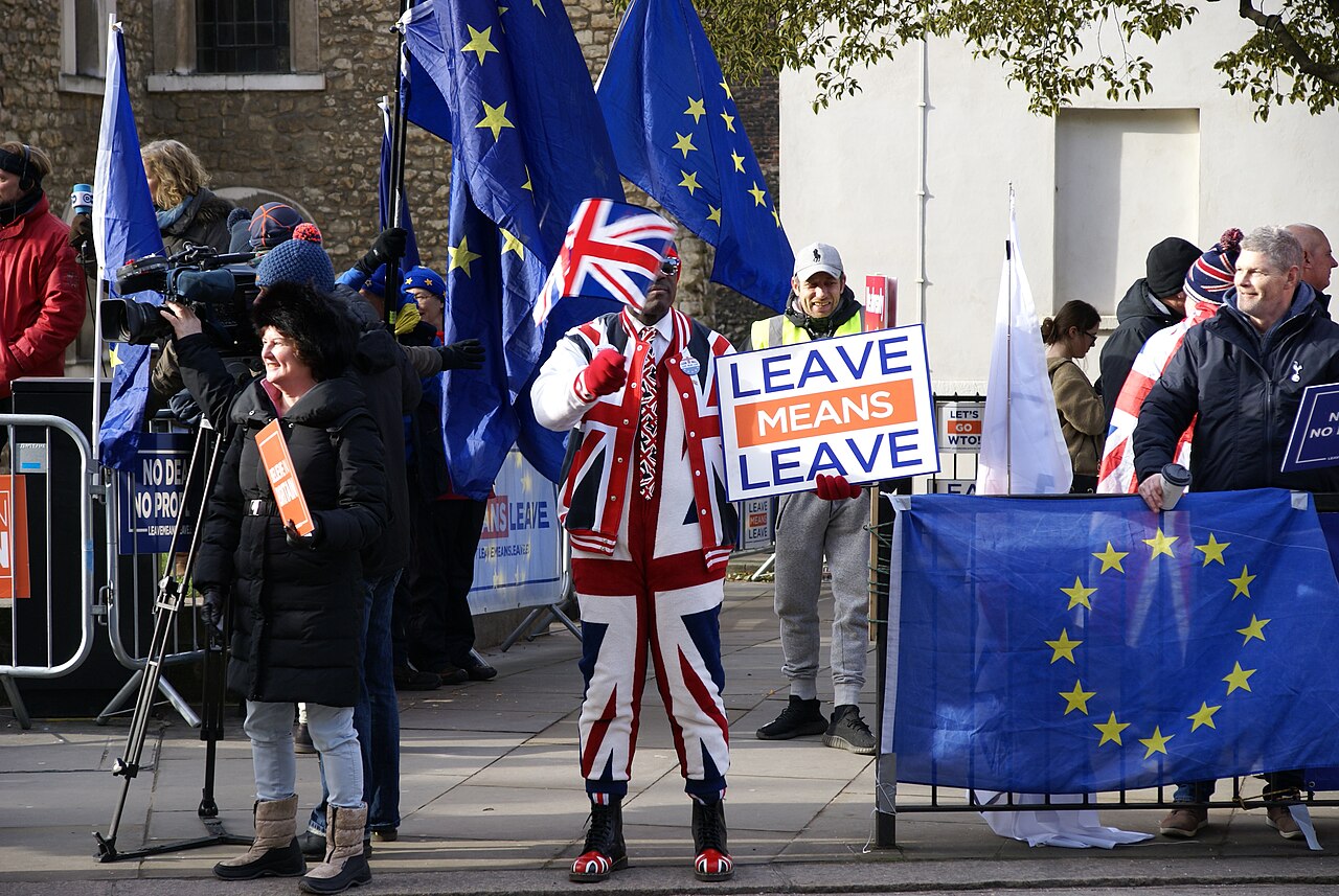 Leave and Remain protesters with EU and Union flags in Westminster during the Brexit debates