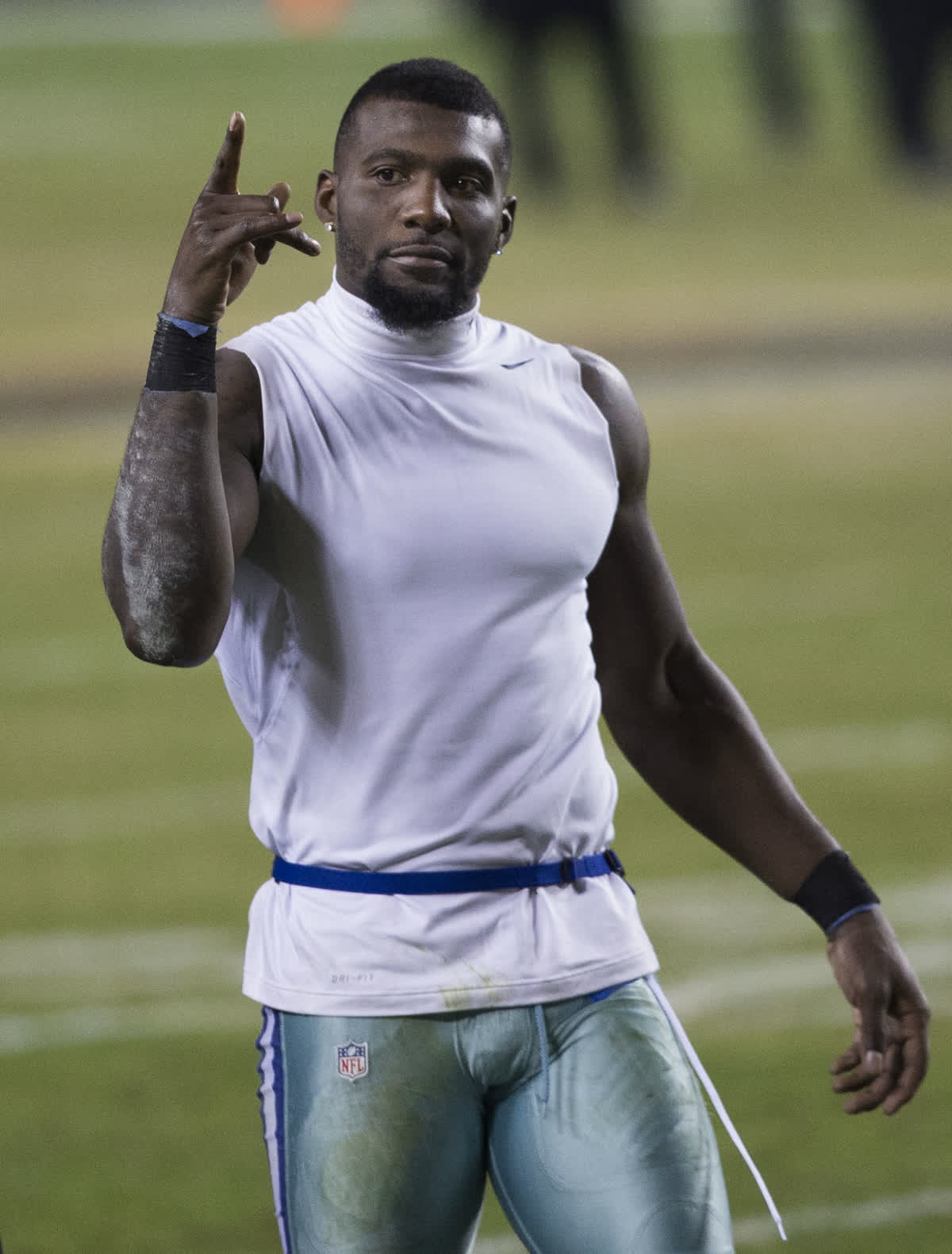 Dez Bryant in his Dallas Cowboys years, throwing up his signature X celebration — file photograph from 2015