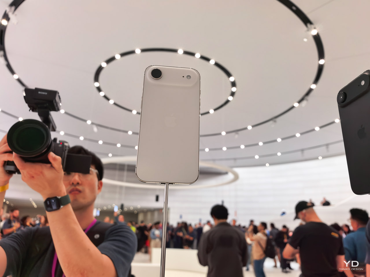 Photograph of an Apple iPhone displayed at a launch event