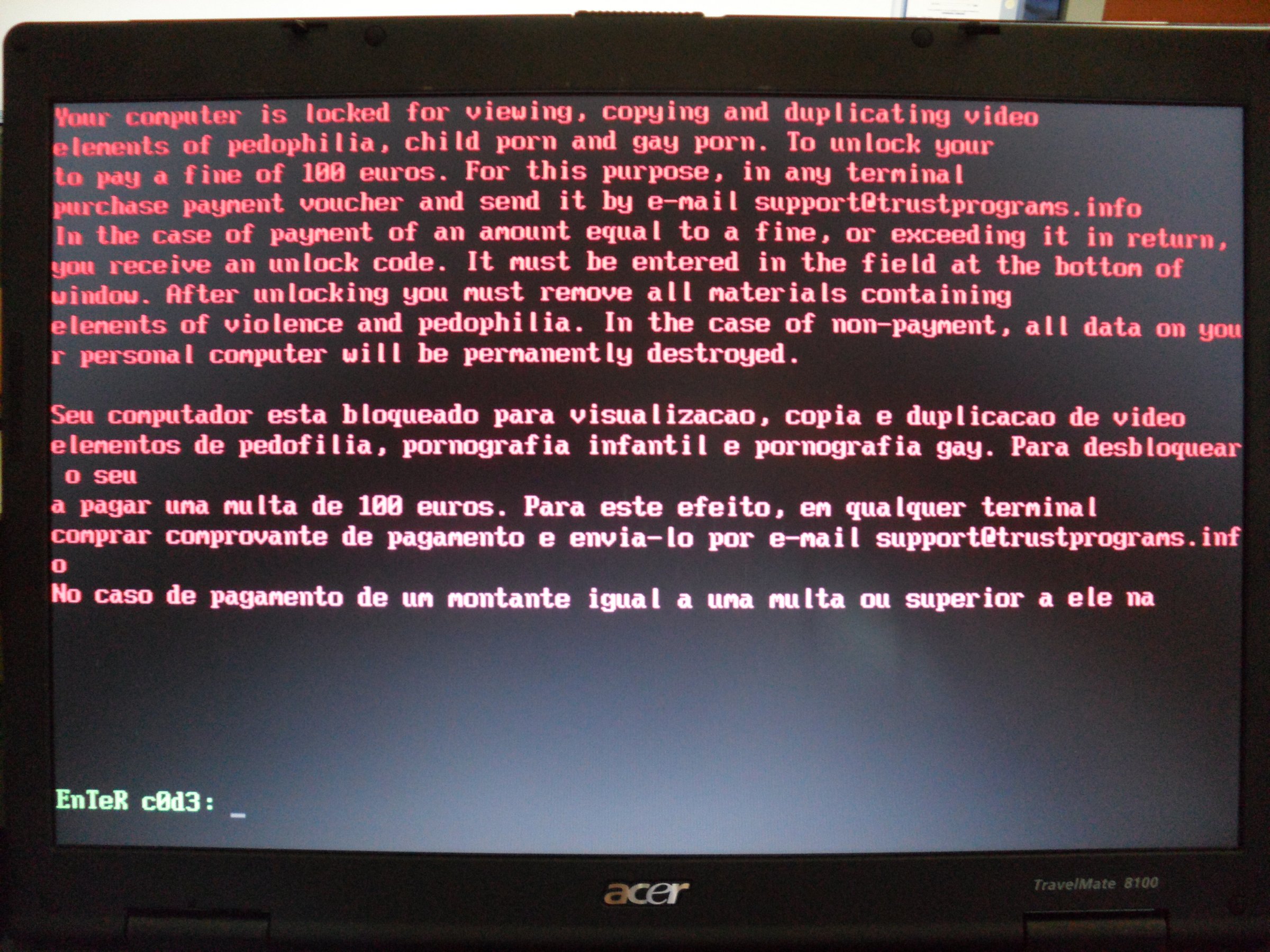 A laptop displaying a trojan warning