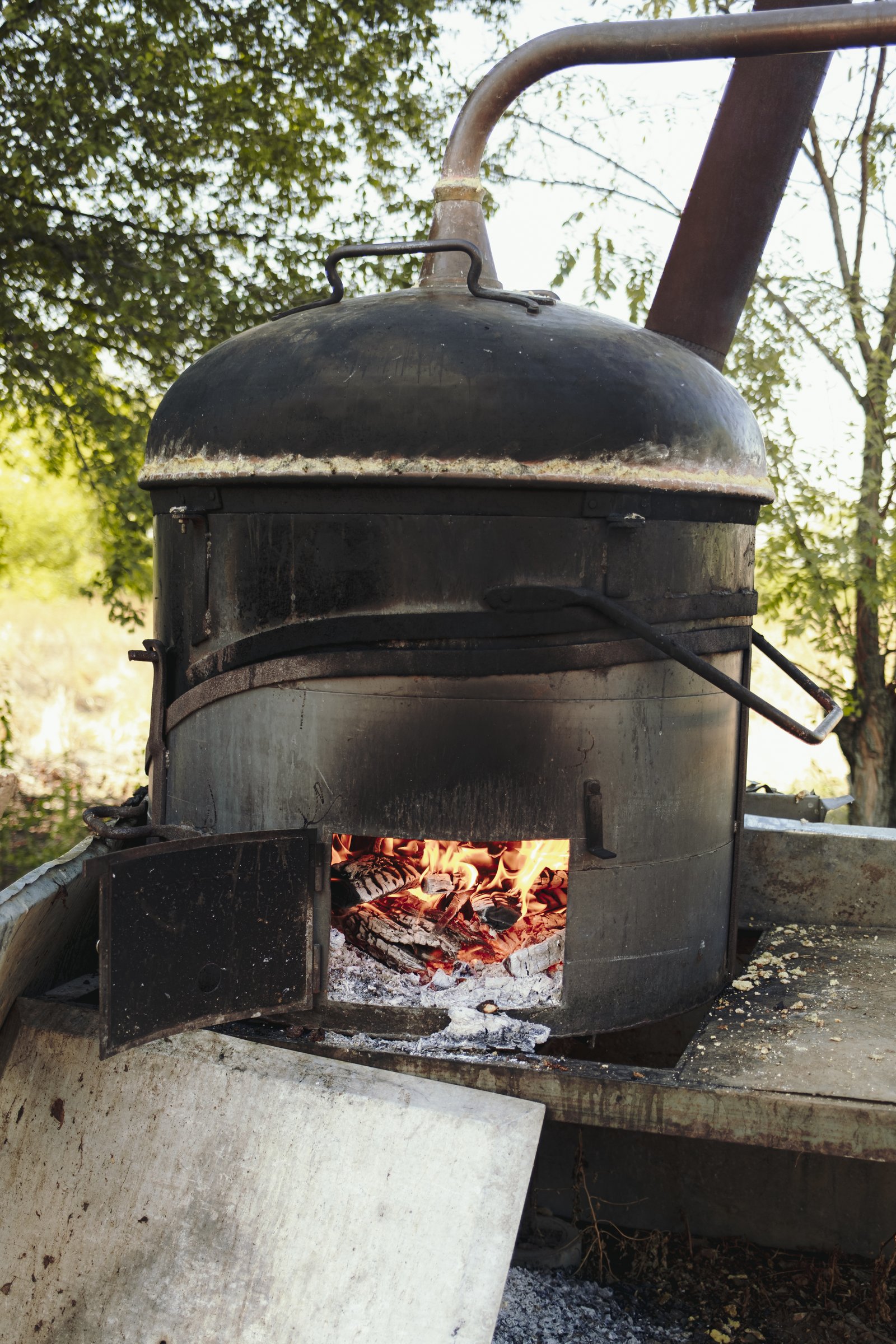 A wood-fired stove with visible flames